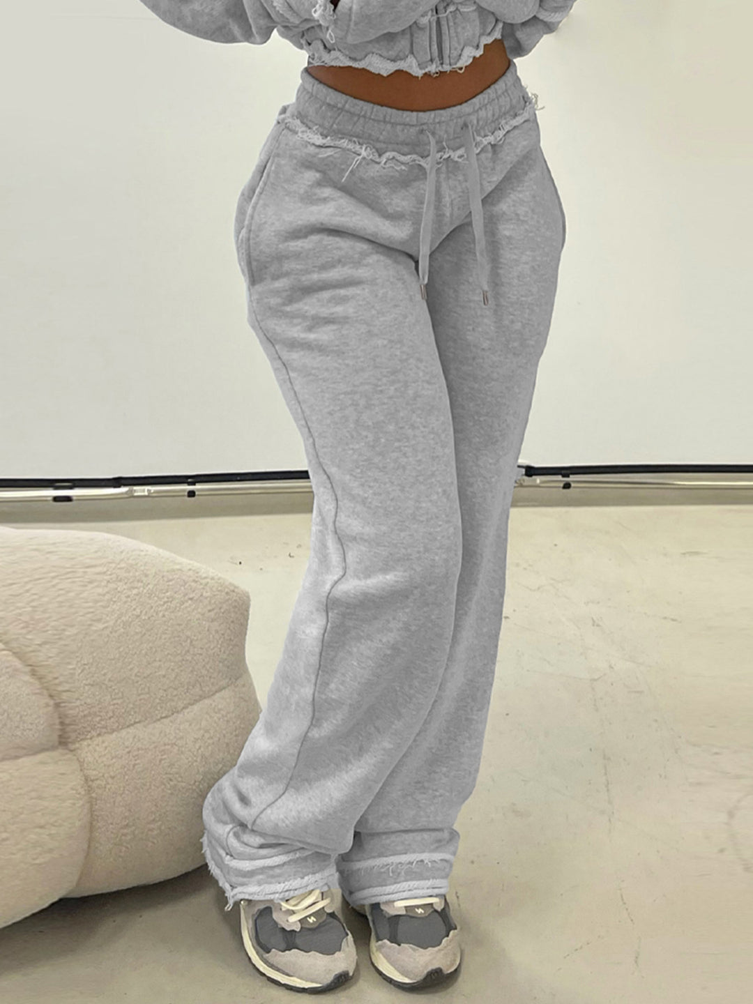 Women's tailored cropped hoodie with full zip, elastic hem, and decorative college print Mune Fashion
