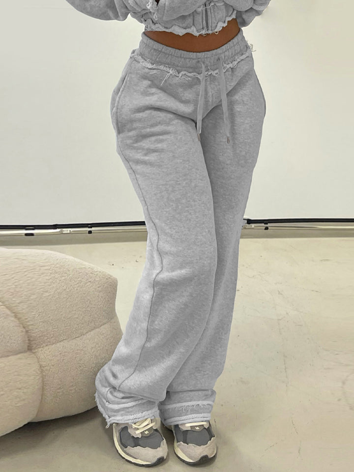 Women's tailored cropped hoodie with full zip, elastic hem, and decorative college print Mune Fashion