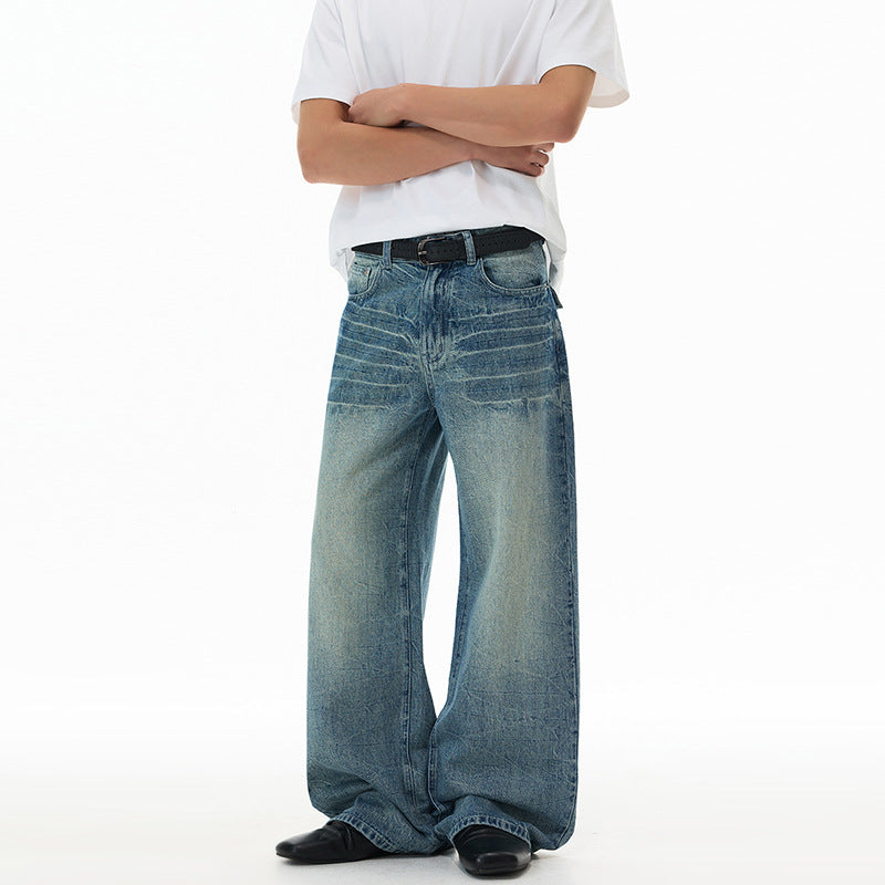 Men's ultra-wide cut denim baggy jeans with striking whisker accents and floor-length hem Mune Fashion