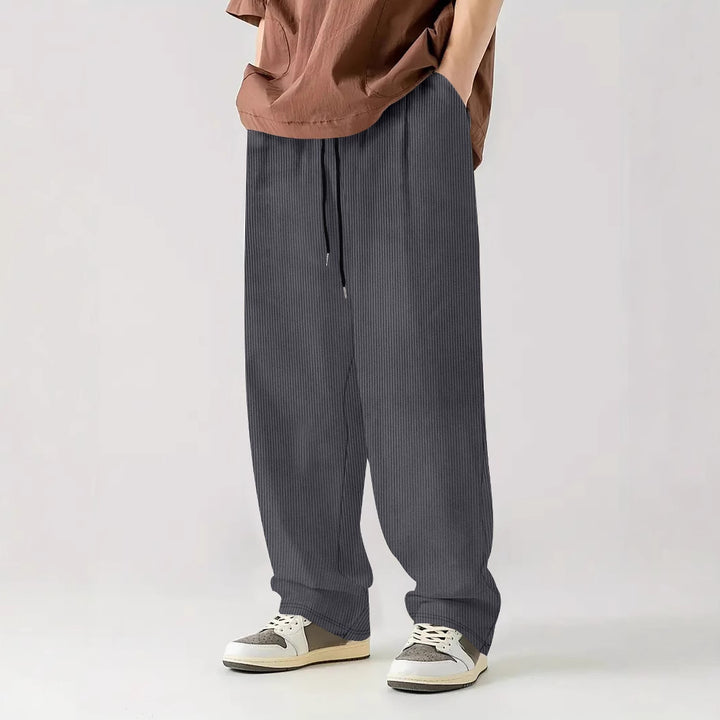 Men's loose Relax leisure pants made of ribbed jersey with drawstring, side pockets, and wide leg Mune Fashion