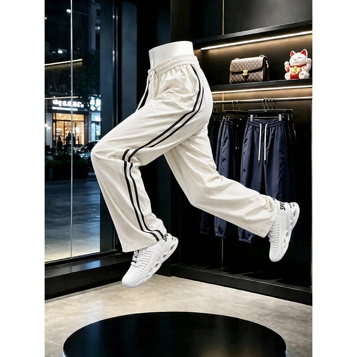 Women's sporty leisure pants with high waistband and side stripes Mune Fashion