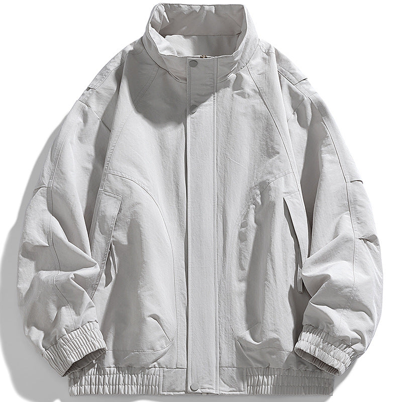 Men's modern utility blouson with standing collar, concealed snap button placket, and elastic hem Mune Fashion