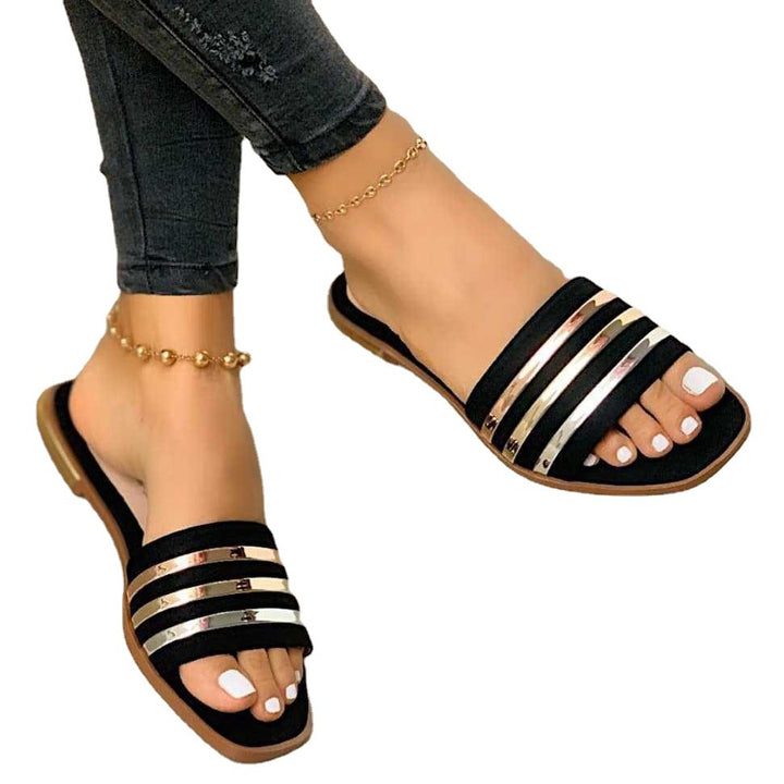 Ladies' flat slip-on sandals with multi-stripe metallic strips and padded comfort footbed Mune Fashion