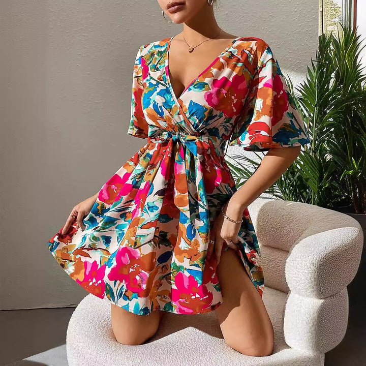 Women's wrap mini dress with deep V-neck, waist lacing, and wide trumpet sleeves Mune Fashion