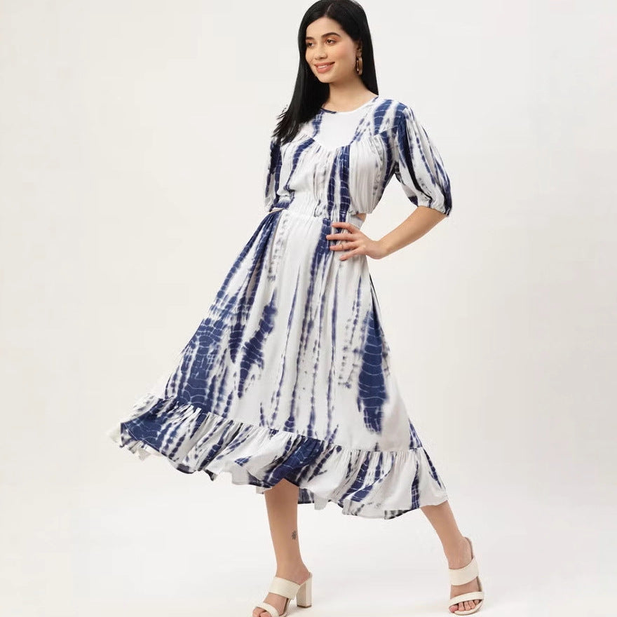 Women’s midi dress with tie-dye print, fitted cut, side cut-out, and ruffled hem.
