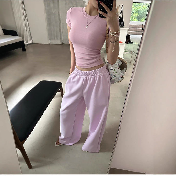 Women's loose lounge pants with elastic waistband, side pockets, and flowing leg Mune Fashion