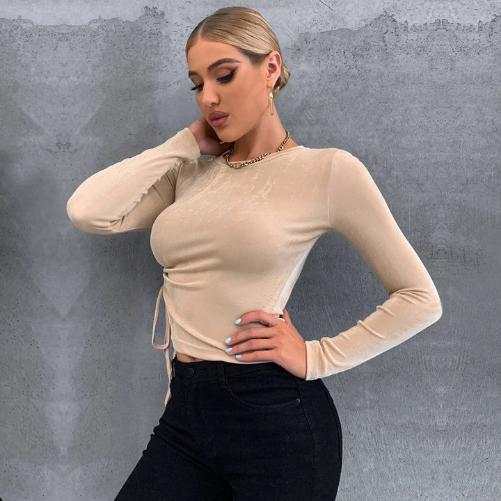 Ladies' figure-hugging long sleeve top with side gathering, drawstring and flattering sculpting fit Mune Fashion