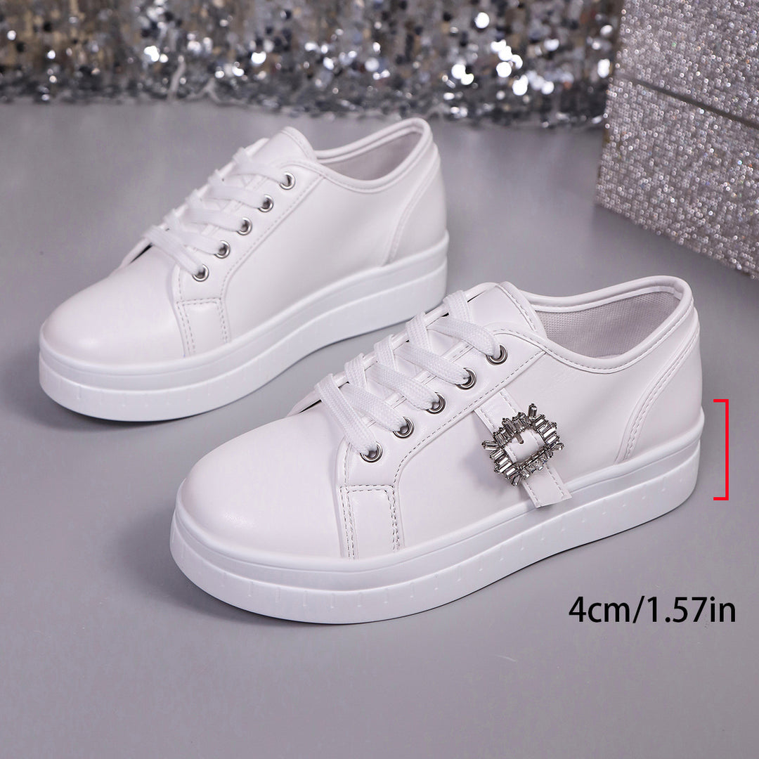 Ladies' platform sneaker with metallic upper material, decorative rhinestone buckle, and padded comfort sole Mune Fashion