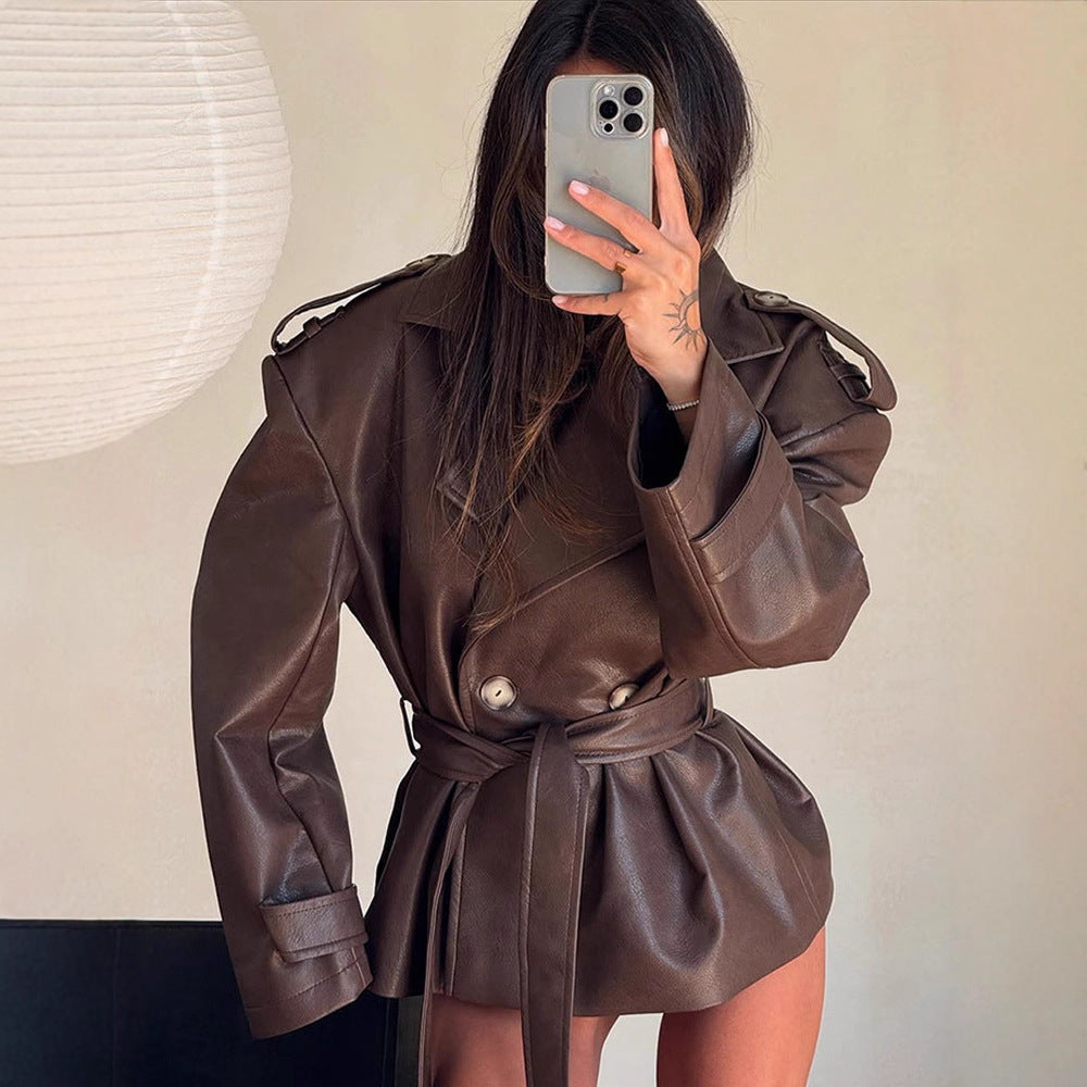 Women's short jacket made of faux leather with waistbelt and oversized shoulder area Mune Fashion
