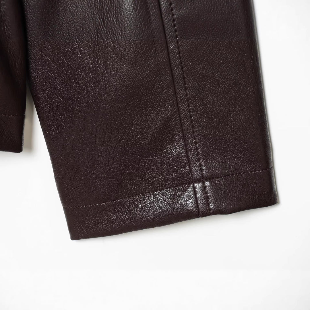 Women's short jacket in vegan leather look with cinching drawstring and flap pockets Mune Fashion
