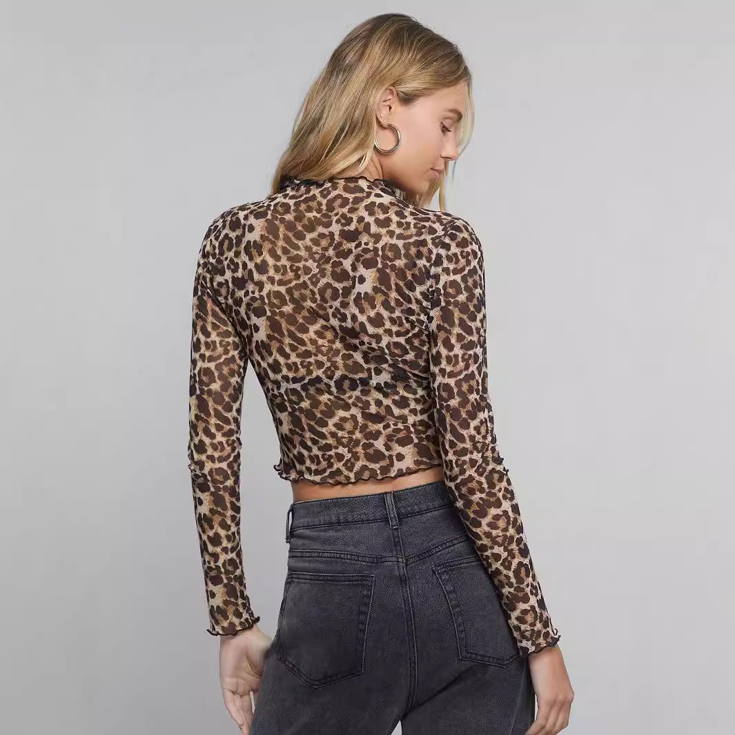 Ladies' figure-hugging cropped long-sleeve shirt in animal print made of fine stretch mesh with stand-up collar and wave hem Mune Fashion