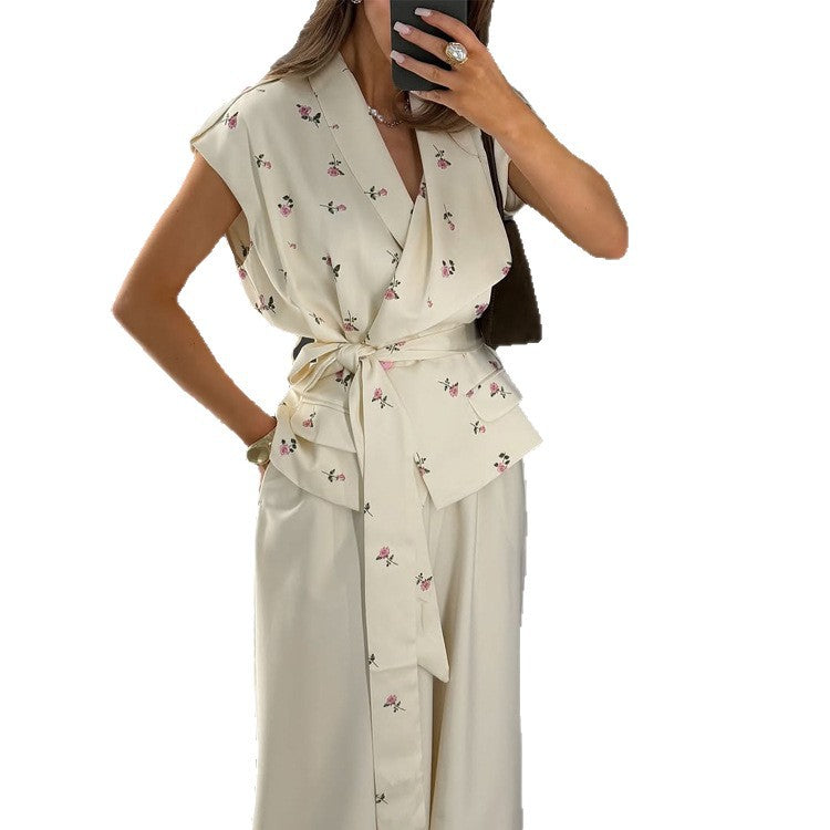 Women's sleeveless wrap blouse with fitted tie belt and patch pockets Mune Fashion