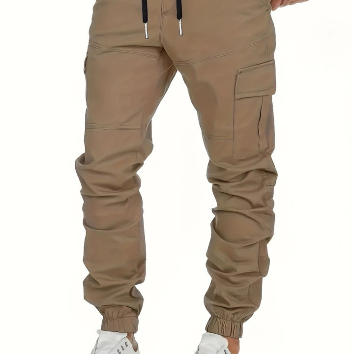 Men's cargo joggers with drawstring, elastic cuffs, and large flap pockets Mune Fashion