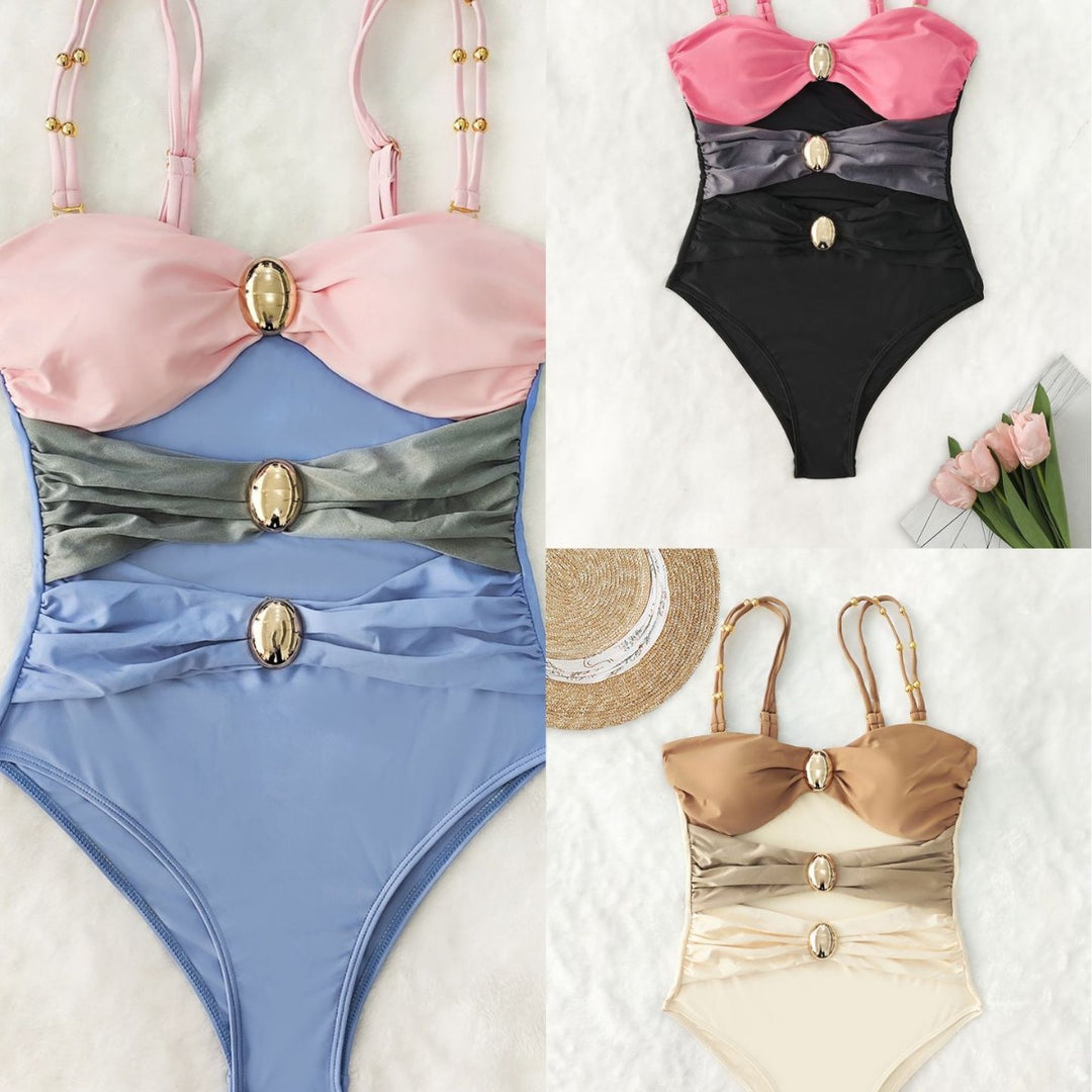 Women's one-piece swimsuit with intricate cut-outs and decorative metal accents Mune Fashion
