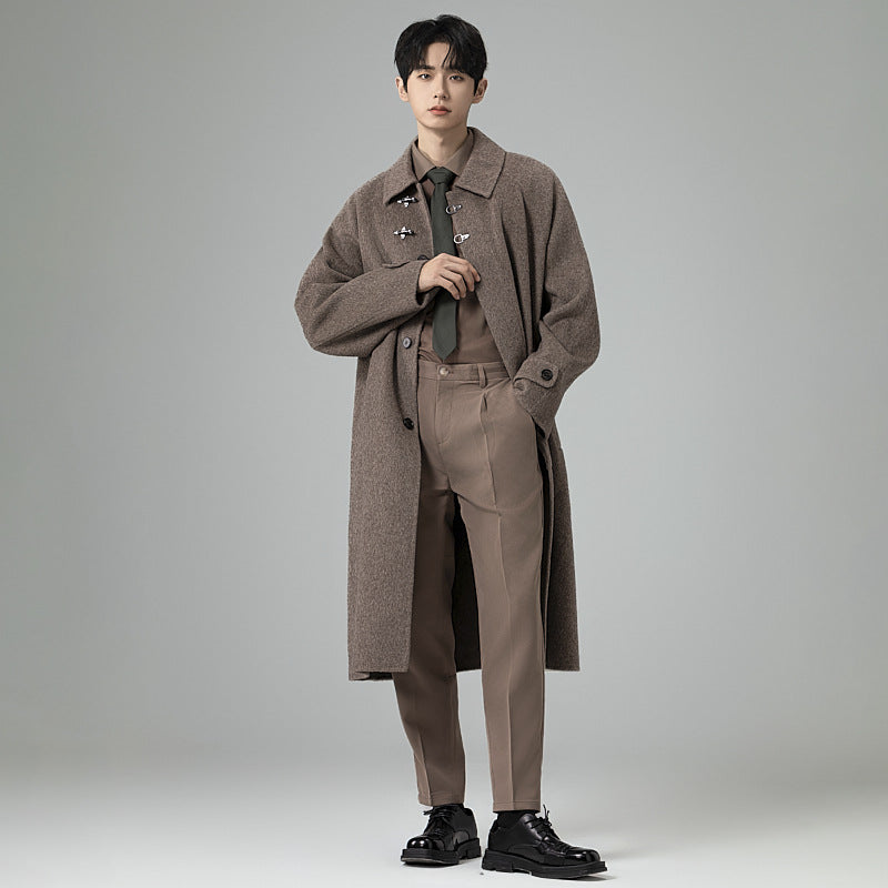 Men's floor-length wool blend coat in oversized cut with distinctive hook closures Mune Fashion