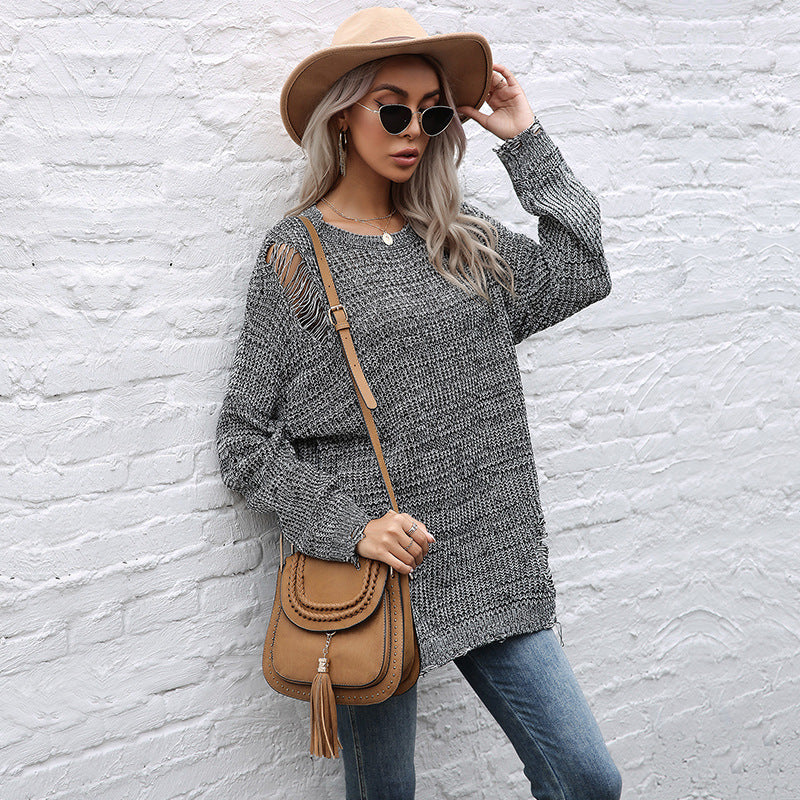 Ladies chunky knit oversized sweater with open stitches, raw hem and round neckline Mune Fashion