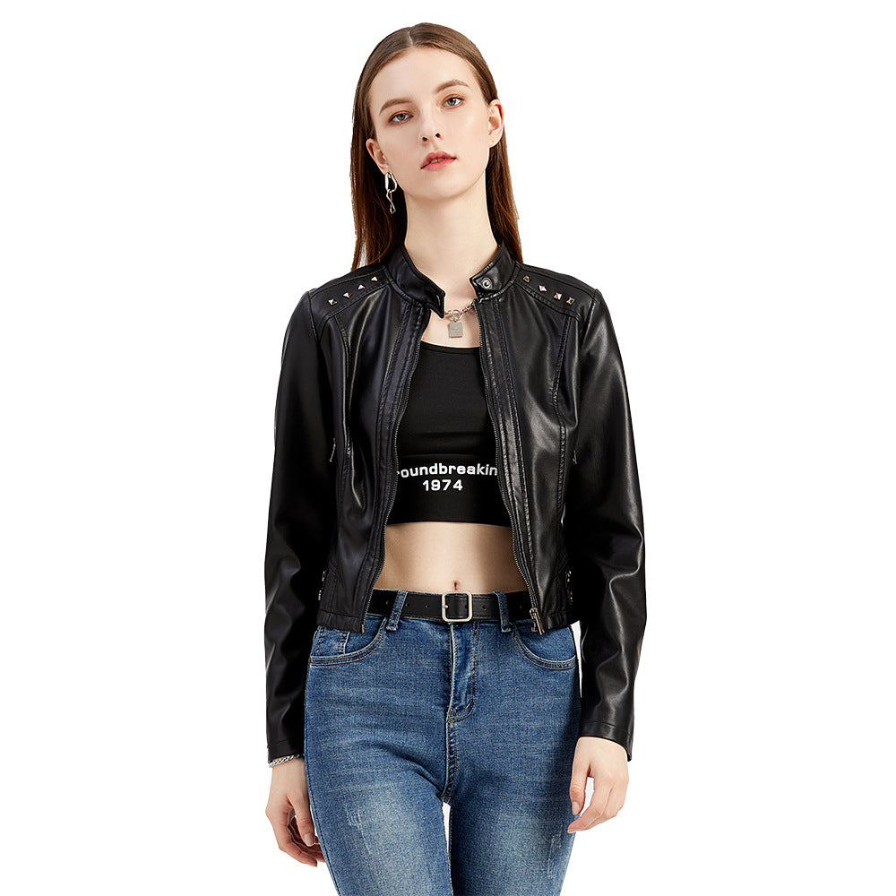 Women's short fitted faux leather jacket with studded detailing and stand-up collar Mune Fashion