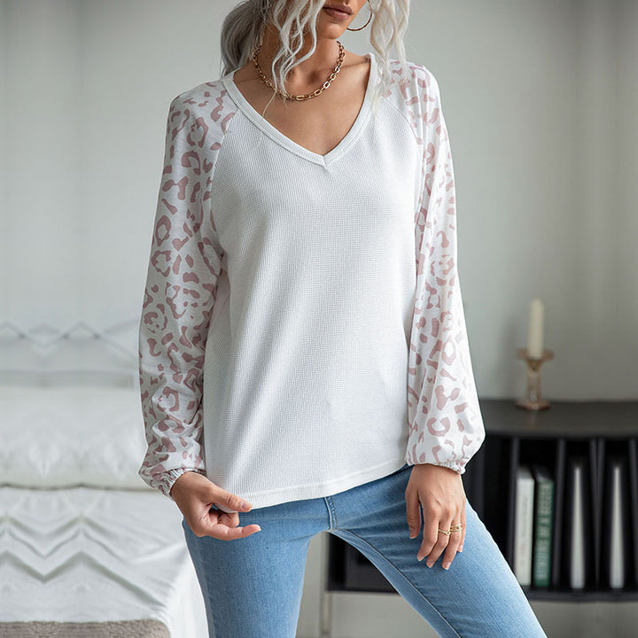 Ladies V-neck waffle knit top with transparent net sleeves in leopard print Mune Fashion