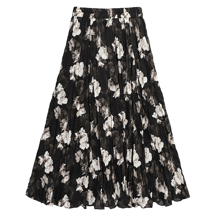 Women's flowing midaxi skirt with asymmetrical wave hem, fine crinkle pleated structure and elastic comfort waistband Mune Fashion