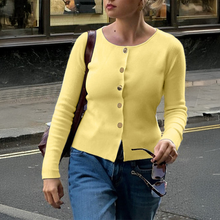 Women’s fitted fine knit cardigan with asymmetrical gold button placket and front slit Mune Fashion