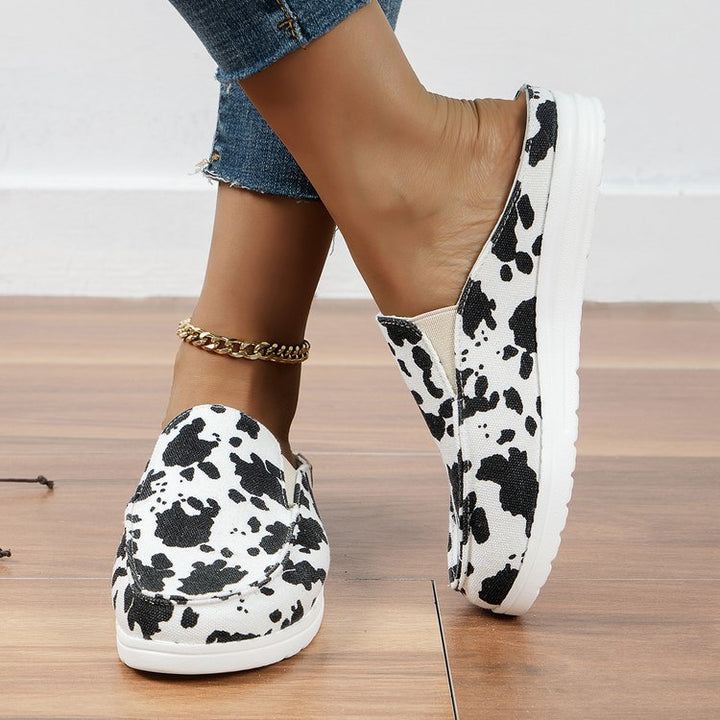 Women's Slip-On Canvas Mules with Cow Spot Print, Padded Comfort Footbed and Non-Slip Lightweight Sole Mune Fashion