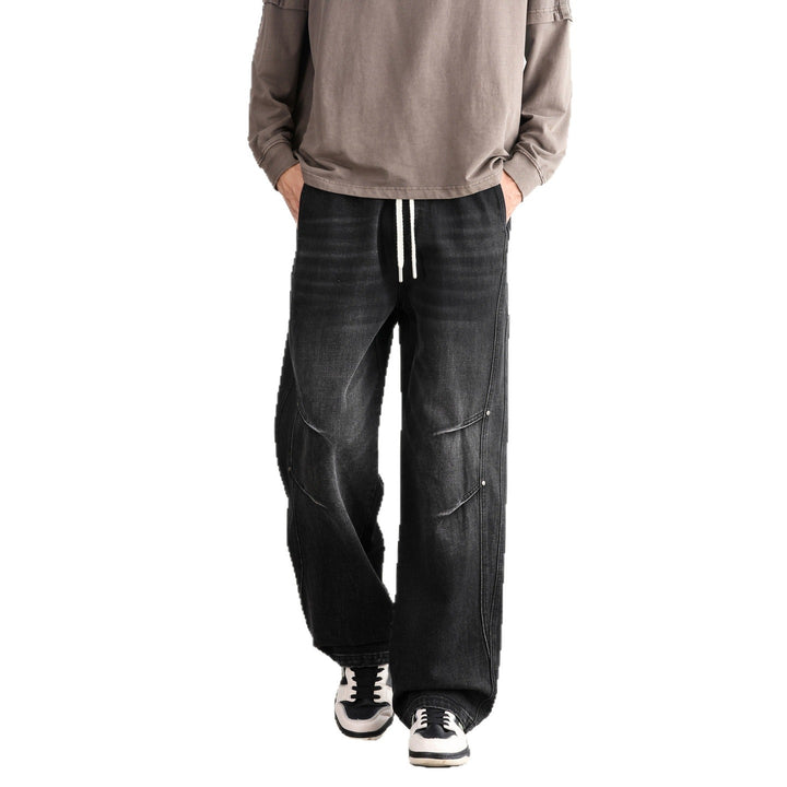 Men's Loose Fit Denim Pants with Drawstring Waistband, Panel Seams and Used Wash Mune Fashion