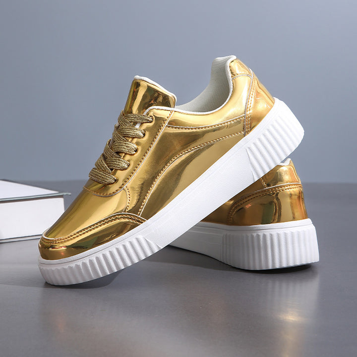 Ladies' low-cut sneakers with reflective patent upper, padded shaft, and raised outsole with groove profile Mune Fashion