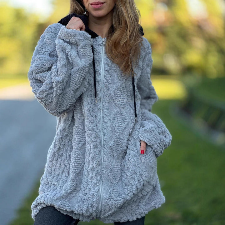 Women's oversized teddy coat jacket with contrasting hood, zipper, and side pockets Mune Fashion