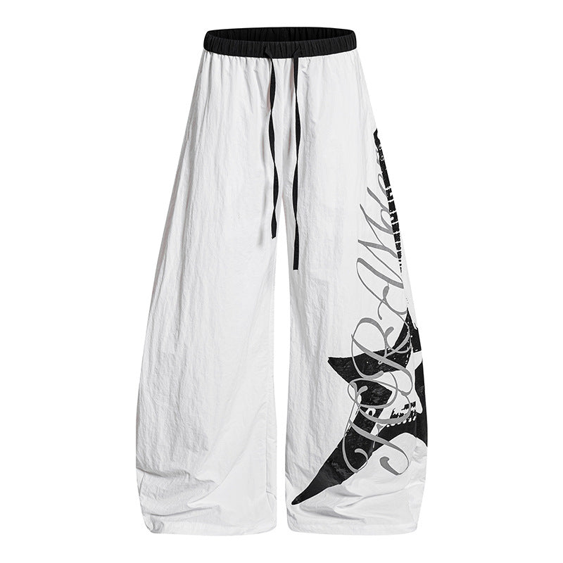 Women's Wide Palazzo Trousers with Drawstring Waist and Large Statement Print Mune Fashion