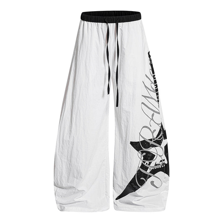 Women's Wide Palazzo Trousers with Drawstring Waist and Large Statement Print Mune Fashion