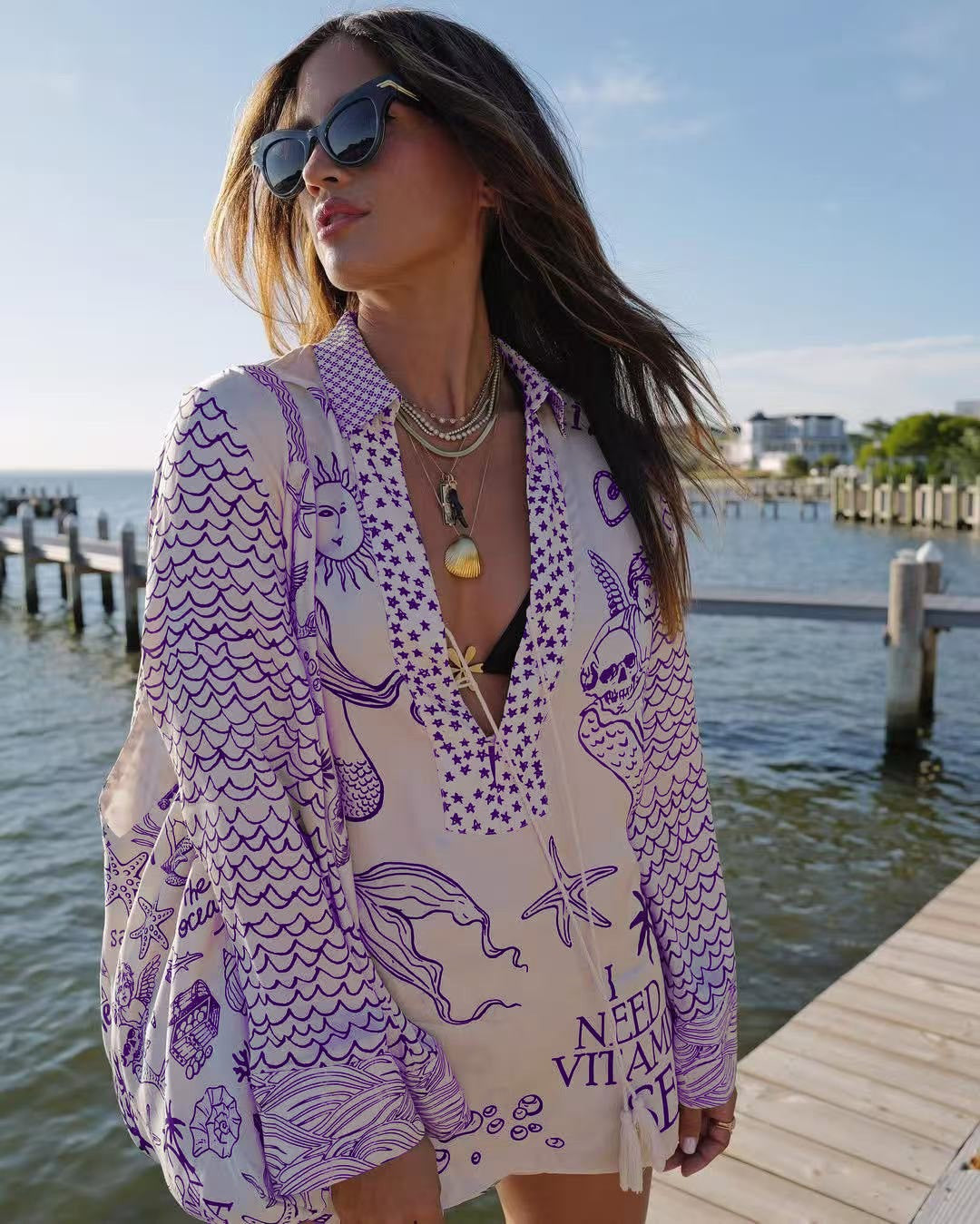 Ladies lightweight beach cover-up in tunic form with deep V-neck, tassel closure, and nautical ocean print Mune Fashion