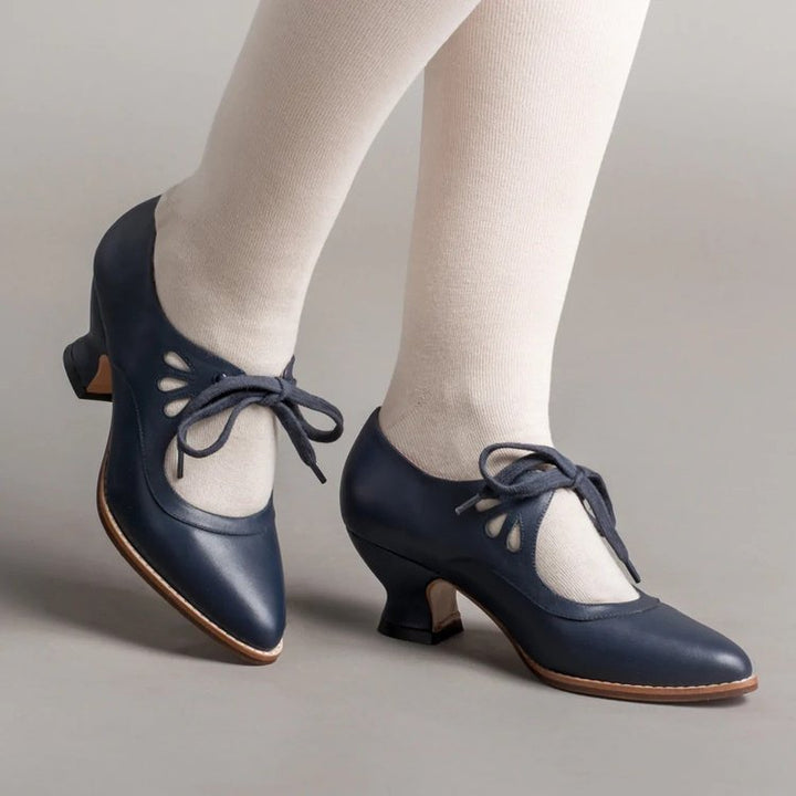 Ladies nan retro strap pumps with curved kitten heel, leaf-shaped cutouts, and decorative bow closure Mune Fashion