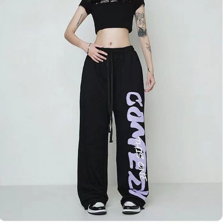 Women's loose lounge pants with elastic waistband, drawstring and distinctive side graphic print Mune Fashion