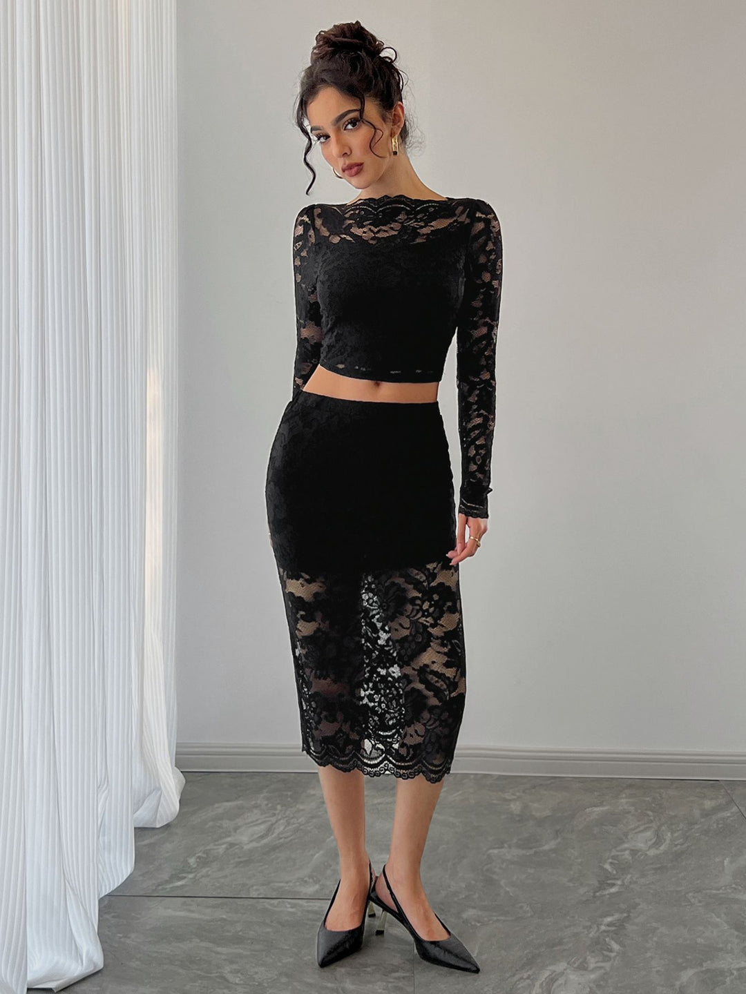 Ladies two-piece lace ensemble with cropped long sleeve top and fitted midi skirt Mune Fashion
