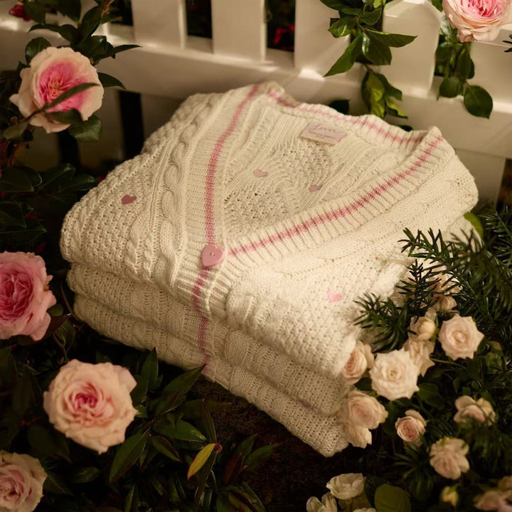 Women’s chunky knitted V-neck cardigan with heart appliqués and decorative heart buttons Mune Fashion