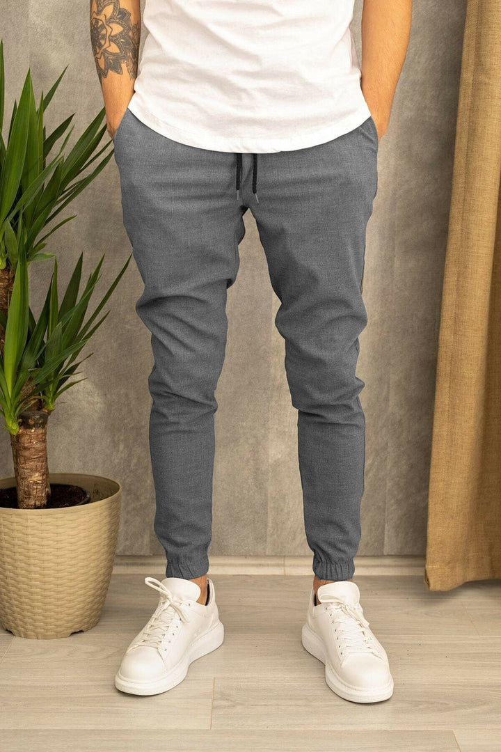 Men's slim fit jogging pants with elastic waistband, drawstring, and ribbed ankle cuff Mune Fashion