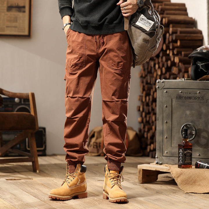 Men's outdoor work jogger pants with elastic comfort waistband, patch round pockets, and ankle zipper Mune Fashion