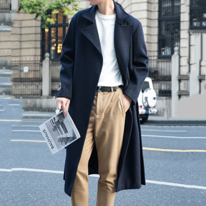 Men's long cut wool coat in minimalist design with generous shawl collar and concealed button placket Mune Fashion