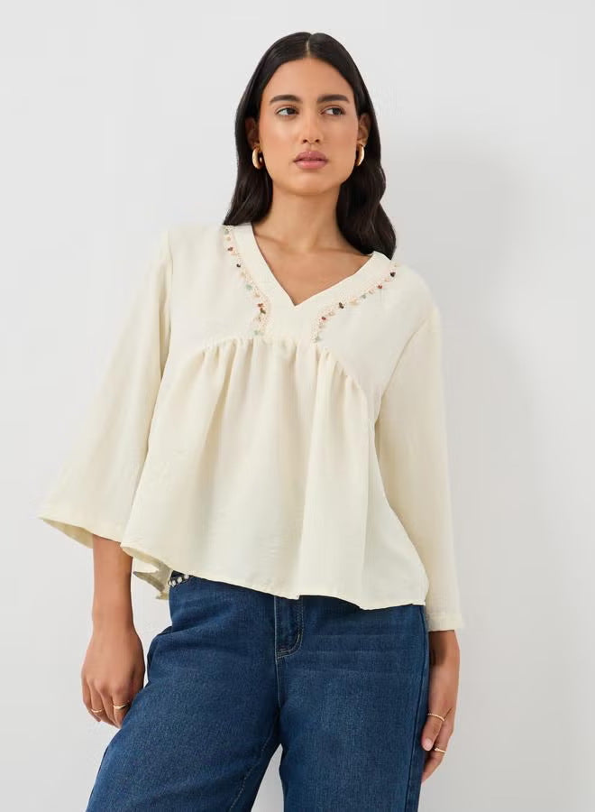 Women's Loose V-Neck Blouse Top with Embroidery Detail and Empire Gathering Drune