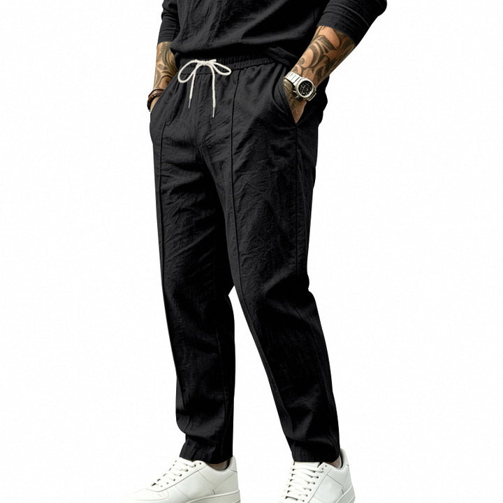 Men's tapered casual chino pants with elastic drawstring waistband, decorative crease and side pockets Mune Fashion
