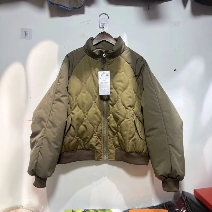 Women's quilted bomber jacket with high stand-up collar, lightweight thermal padding, and ribbed cuffs Mune Fashion