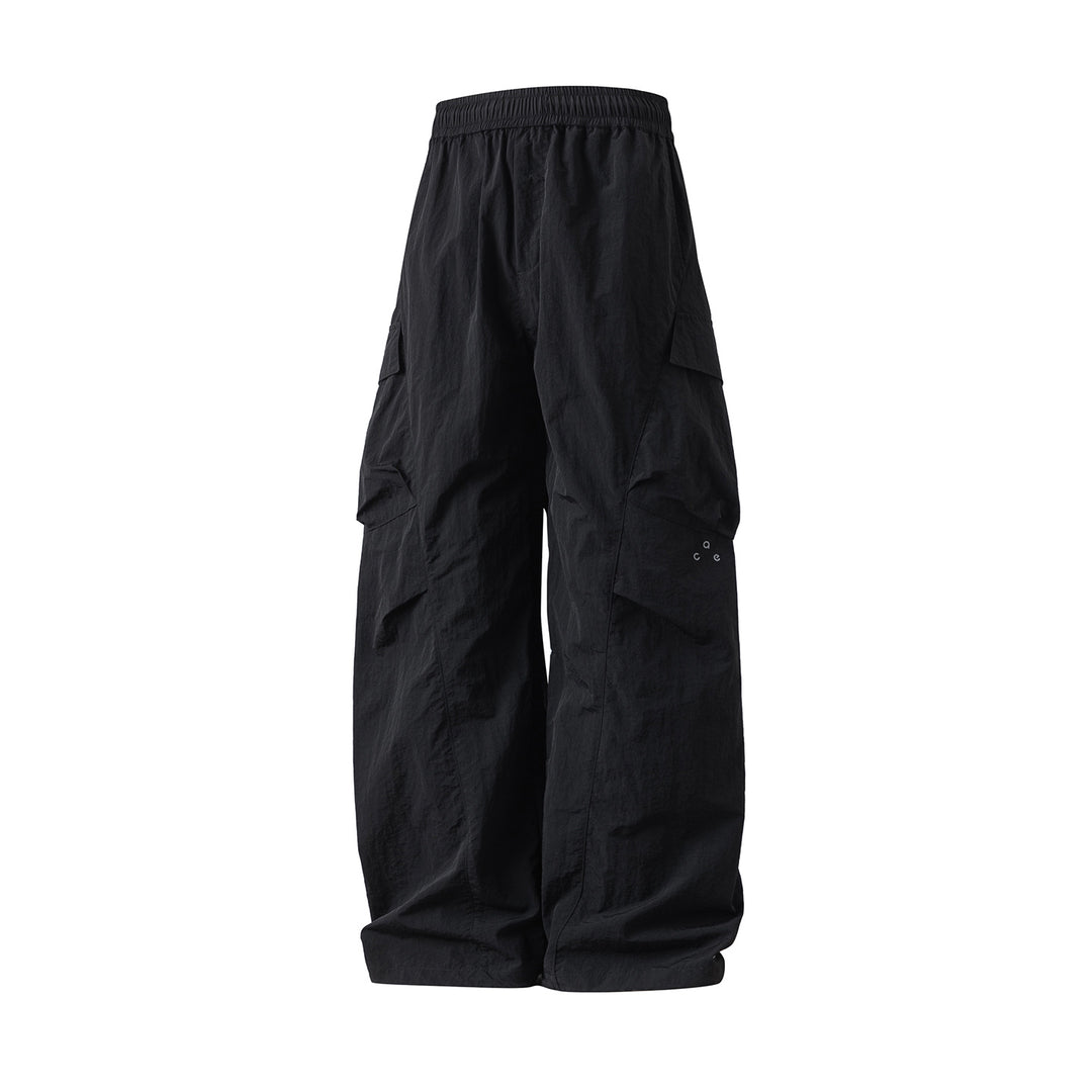 Unisex Wide Cargo Palazzo Pants made of technical crinkle nylon with elastic waistband Mune Fashion