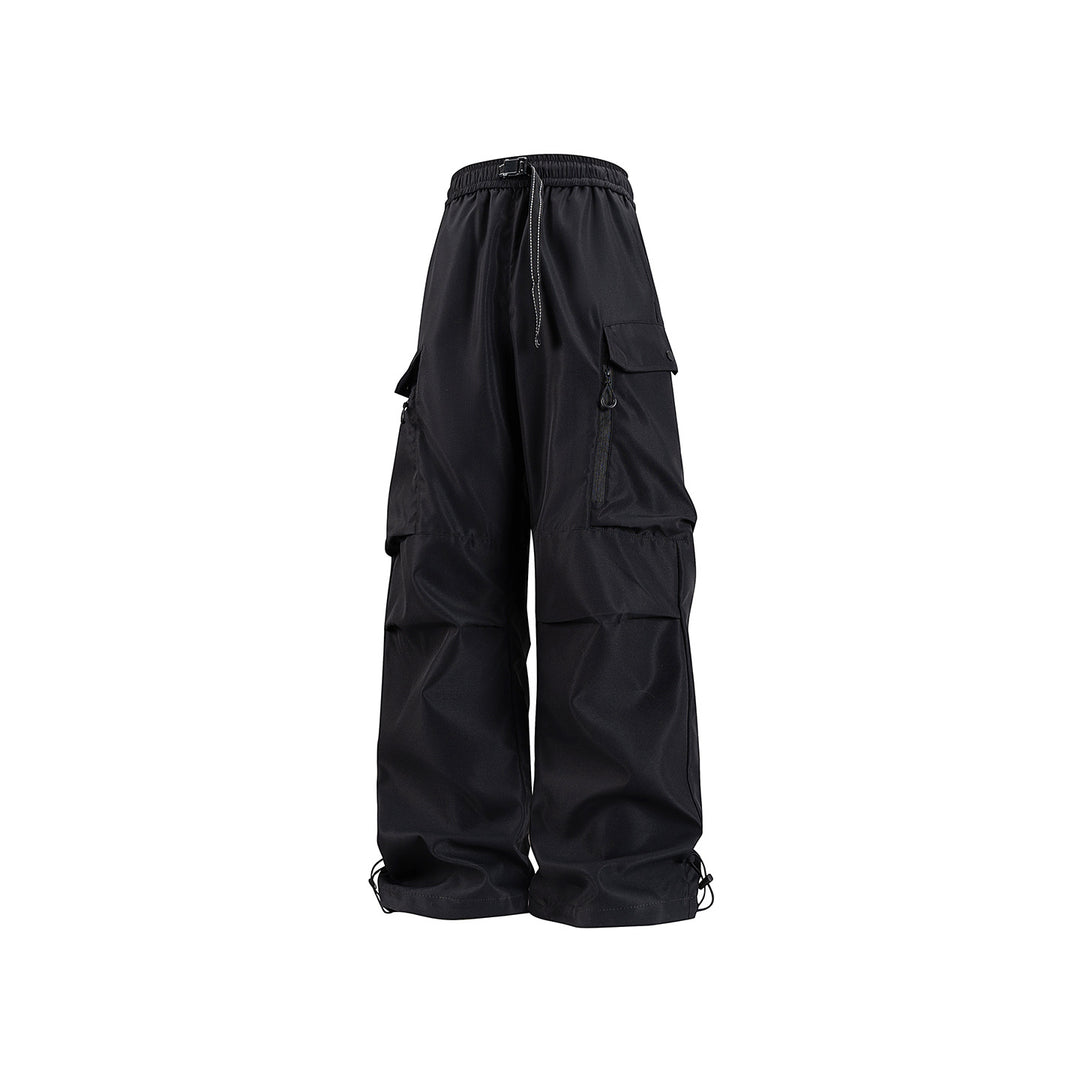 Unisex Wide technical cargo pants with multi-function pockets, drawstring and adjustable leg hems Drune
