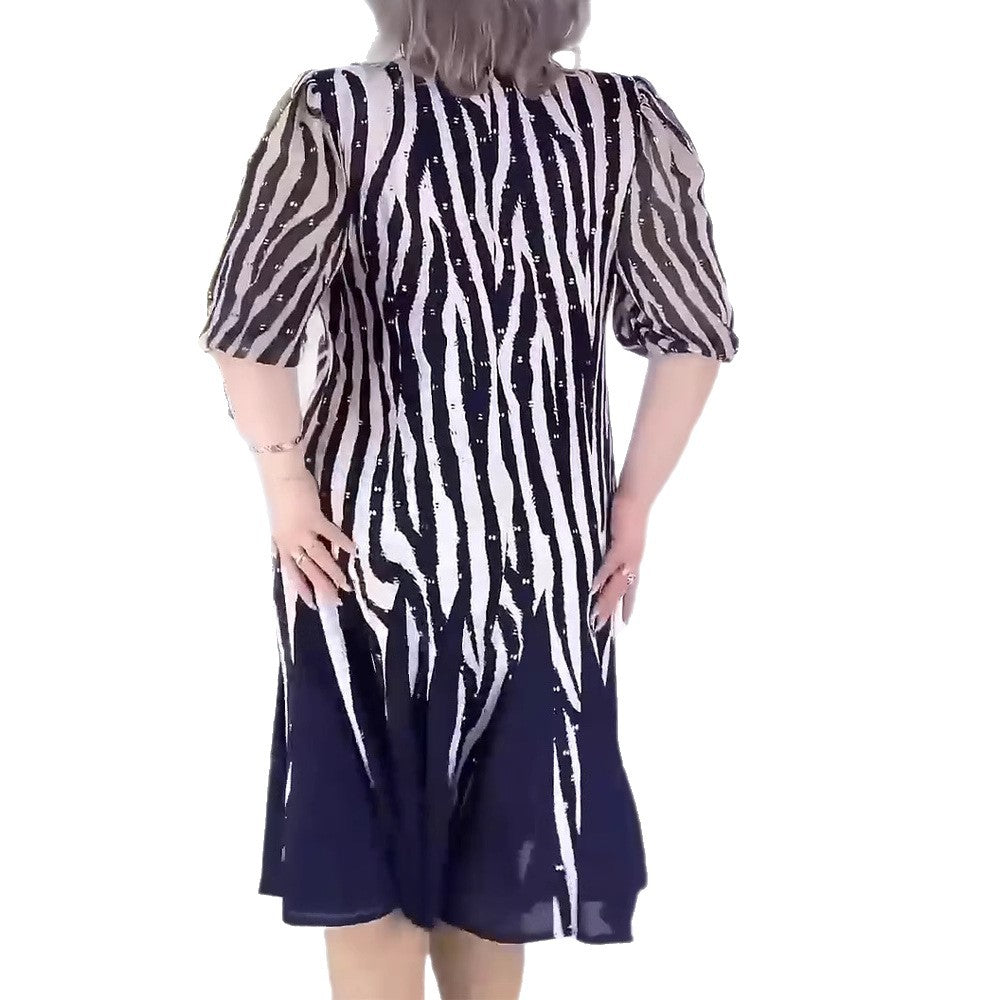 Ladies' fitted midi dress with graphic animal print, transparent puff sleeves and swinging pleated skirt Mune Fashion