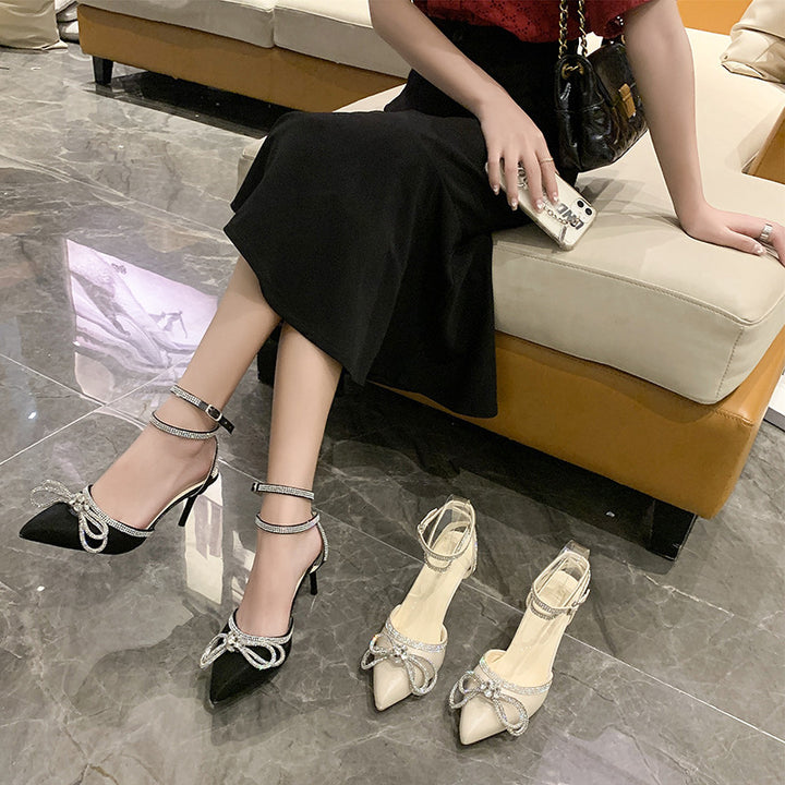 Women's pointed strap pumps with sparkling rhinestone bow appliqué and adjustable ankle strap Mune Fashion