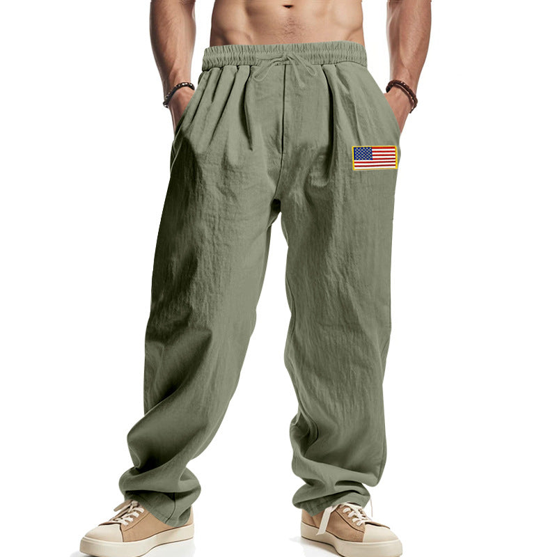 Men's loose-fitting leisure pants in linen look with elastic waist, drawstring & flag patch Mune Fashion