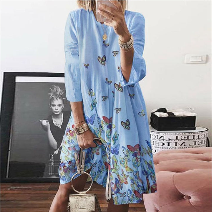 Women's airy midi dress with palm print, half-length sleeves and A-line cut Mune Fashion