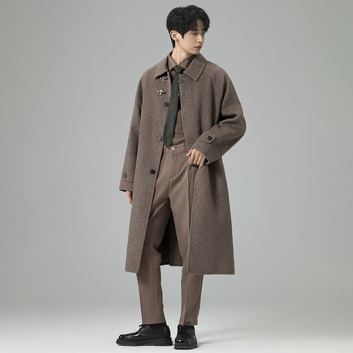 Men's floor-length wool blend coat in oversized cut with distinctive hook closures Mune Fashion