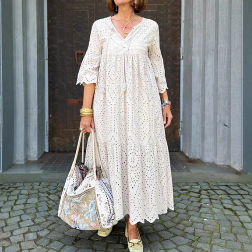 Women's flowing maxi dress with openwork embroidery, V-neck, underbust seam, and ruffled skirt Mune Fashion