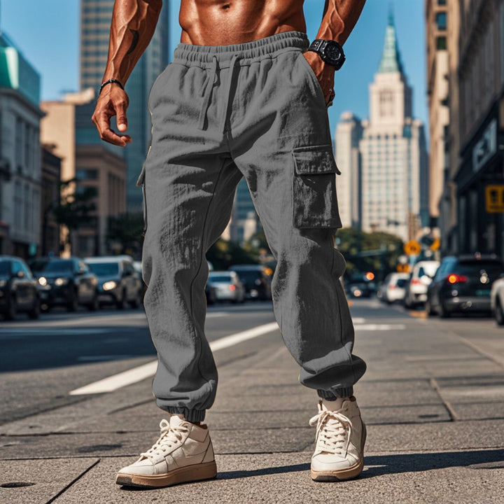 Men's sporty work-inspired joggers with patch flap pockets, elastic drawstring waistband, and gathered leg cuffs Mune Fashion
